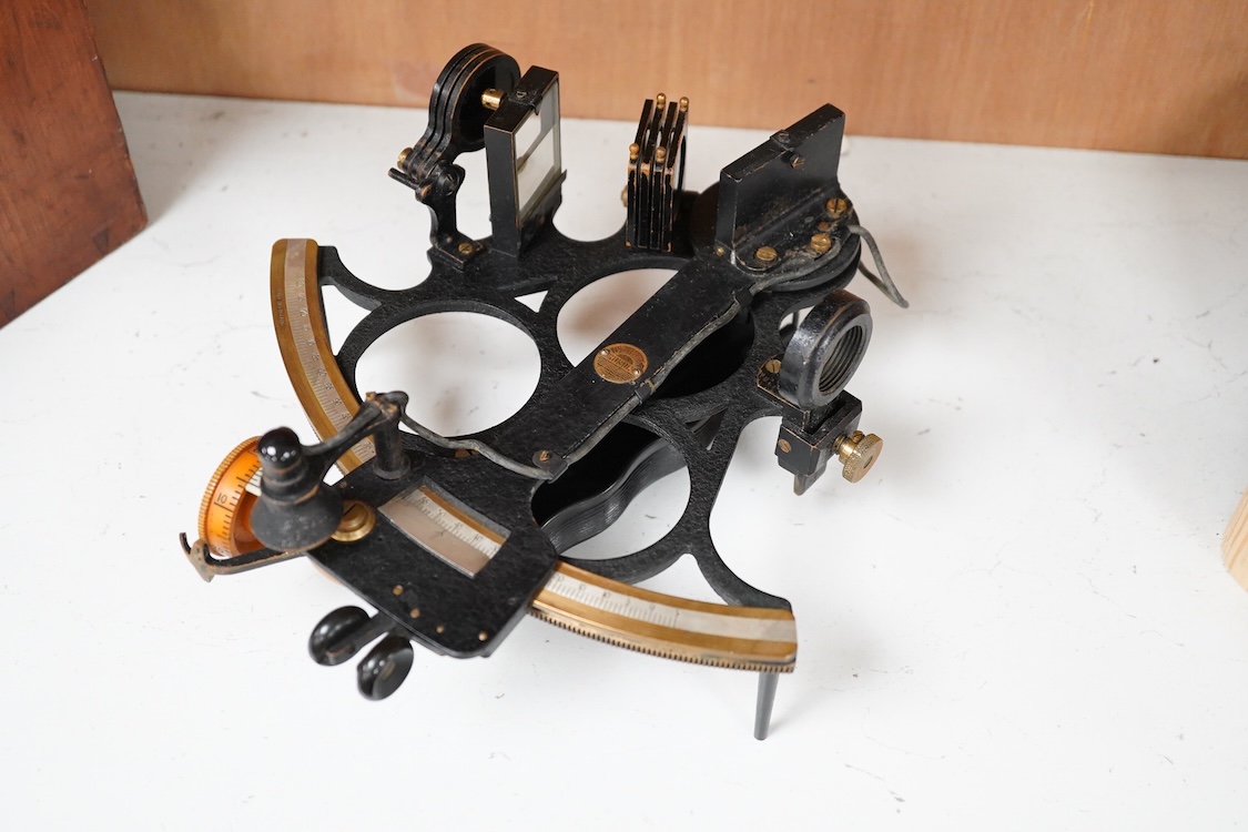 An early 20th century H. Hughes & Son Ltd. London, ‘Husun’ mahogany cased sextant, with engraved maker to the scale, also engrave serial number 29221, and with a battery pack for illuminating the scale, plaque to the ins